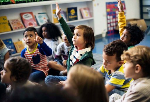 kindergarten-students-sitting-on-the-floor-PG23Y8C.jpg